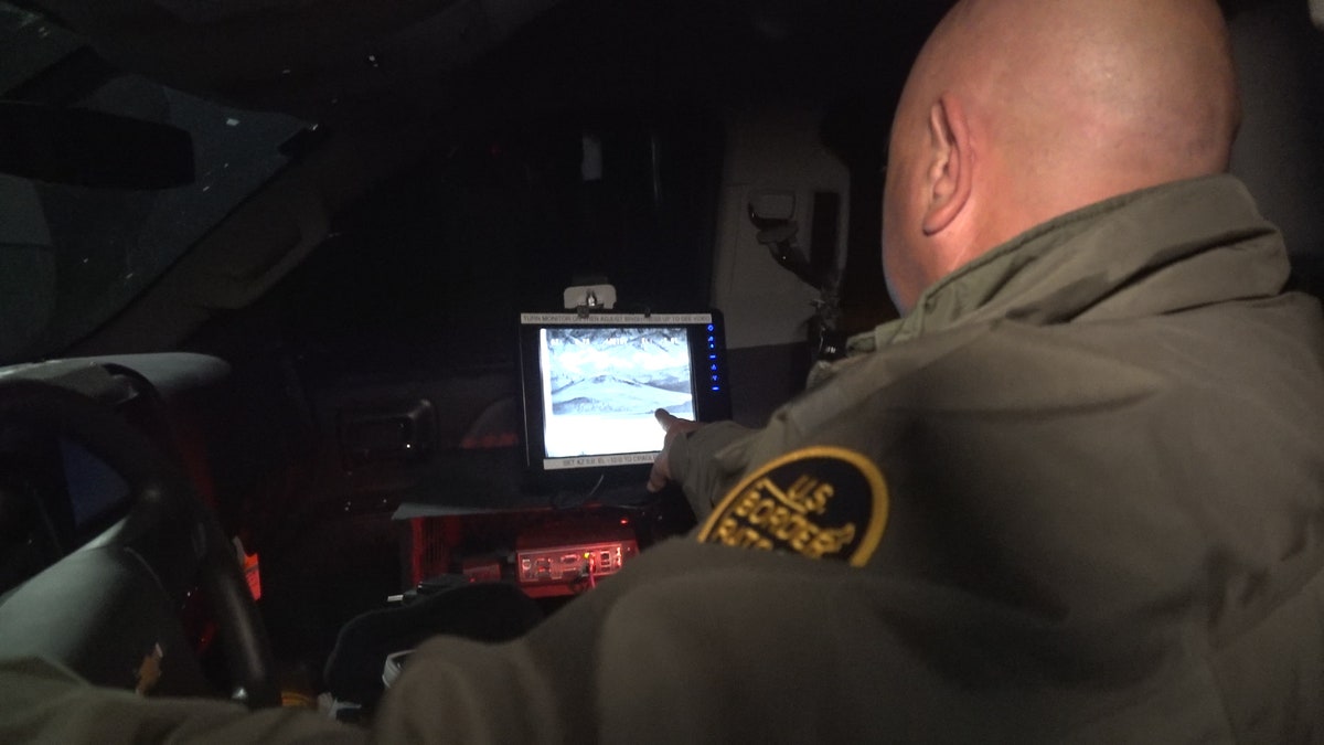 Border Patrol agent Cordero shows the infrared cameras agents use at night to detect movement across the border.