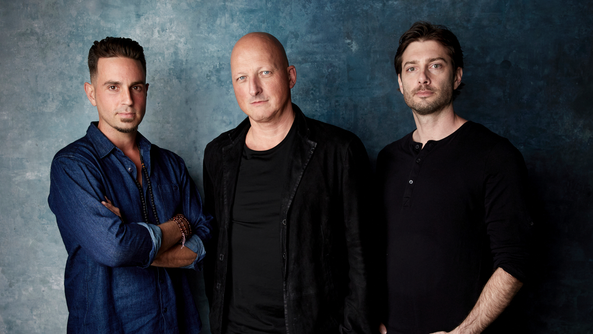 Wade Robson, from left, director Dan Reed and James Safechuck pose for a portrait to promote the film 
