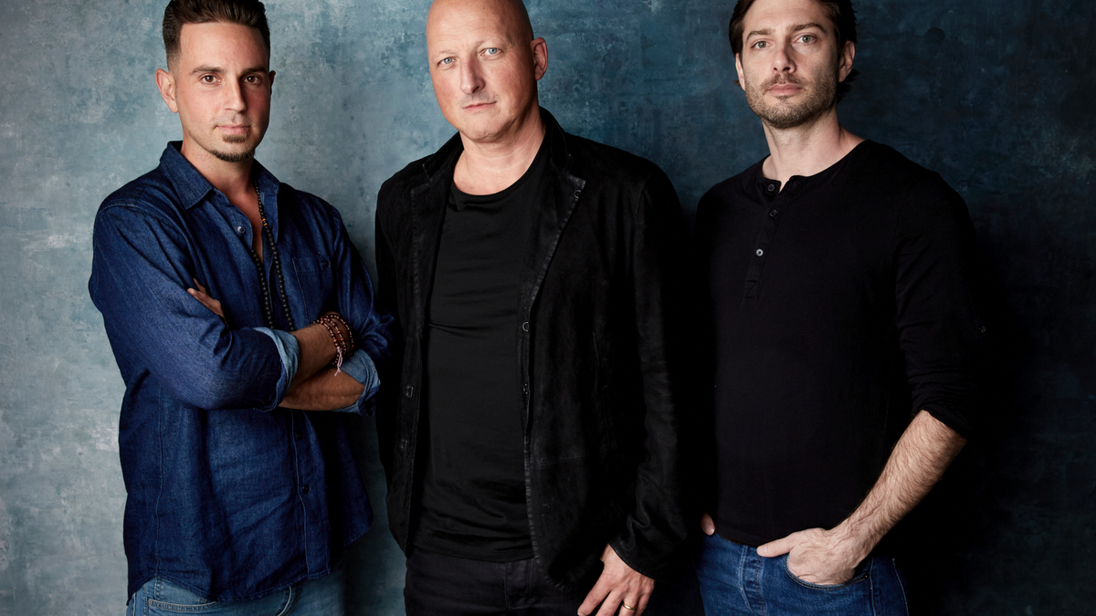 Wade Robson, from left, director Dan Reed and James Safechuck pose for a portrait to promote the film 