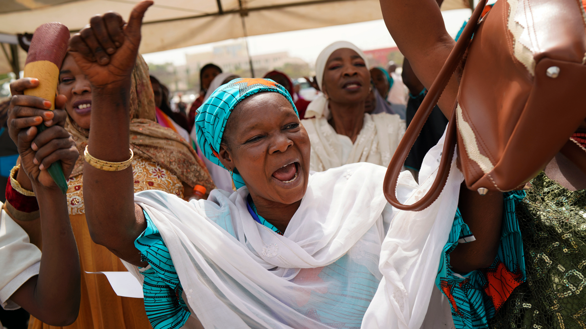 Nigerian women attend an inter-faith prayer rally organized by the Freedom and Justice Party in Abuja, Nigeria, Thursday Feb. 14, 2019. Incumbent President Muhammadu Buhari is to face opposition presidential candidate Atiku Abubakarin on Saturday, Feb. 16 in Nigeria's general election. (AP Photo/Jerome Delay)