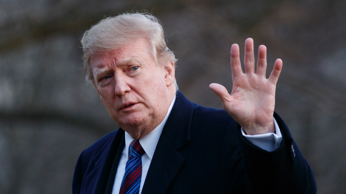 President Donald Trump waves after arriving on Marine One on the South Lawn of the White House in Washington, Friday, Feb. 8, 2019. The President was returning to the White House after his annual physical exam at Walter Reed National Military Medical Center. (AP Photo/Carolyn Kaster)