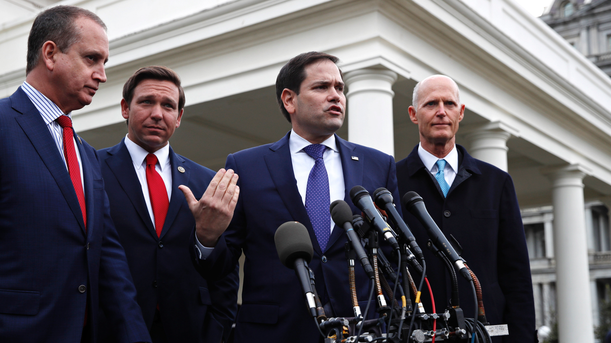 In this Jan. 22, 2019, photo, Rep. Mario Diaz-Balart, R-Fla., left, Florida Gov. Ron DeSantis, Sen. Marco Rubio, R-Fla., and Sen. Rick Scott, R-Fla., speak to the media after their meeting with President Donald Trump about Venezuela, at the White House in Washington.