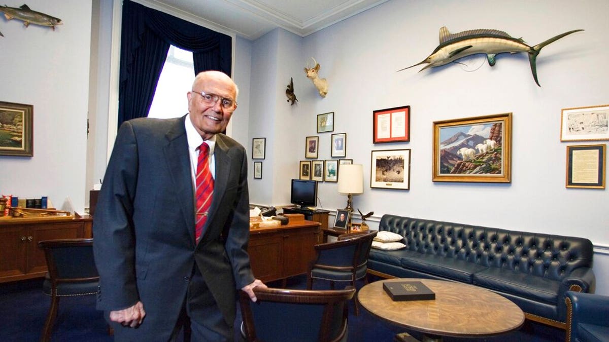 FILE- In a Feb. 4, 2009 file photo, Rep. John Dingell, D-Mich. poses for a photograph inside his office in House Rayburn Office Building on Capitol Hill in Washington. (AP Photo/Manuel Balce Ceneta, File)