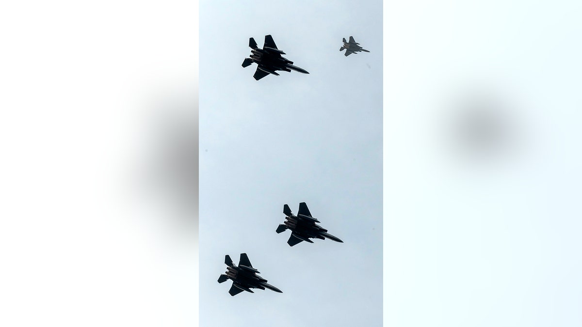 F-15 planes seen from Endcliffe Park in Sheffield, as warplanes from Britain and the United States stage a flyover in tribute to ten dead US airmen. Tony Foulds was just a child playing in the park on Feb. 22, 1944, when a U.S. Air Force crew decided to crash and die rather than take the chance of hitting the playing children.