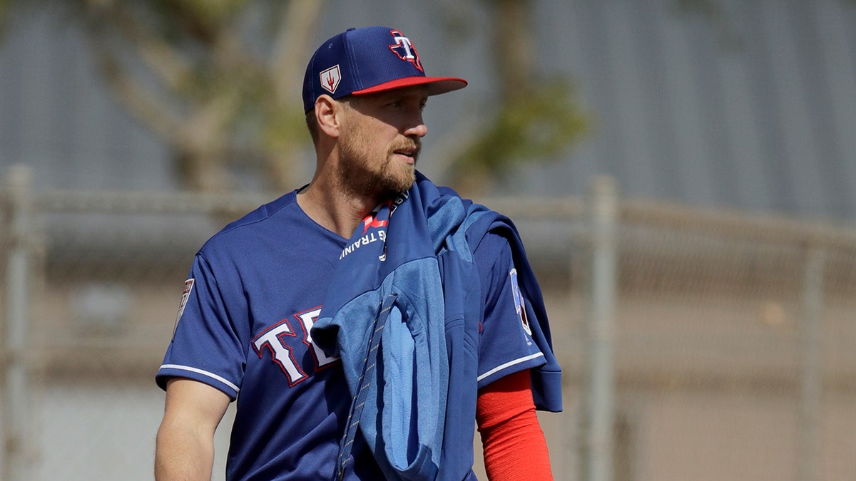 Texas Rangers' Hunter Pence walks to a practice field during spring training baseball practice Monday, Feb. 18, 2019, in Surprise, Ariz.