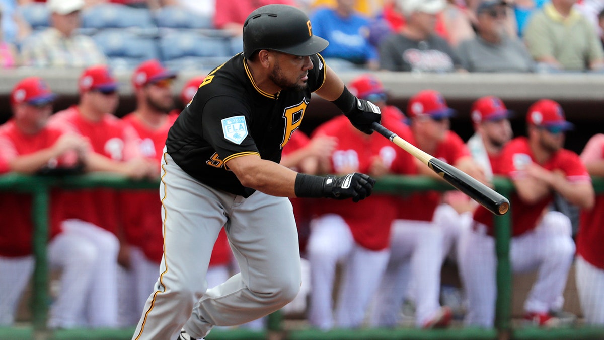 Pittsburgh Pirates' Melky Cabrera grounds out in the fourth inning with the runner Kevin Newman advancing to third in the fourth inning during a spring training baseball game against the Philadelphia Phillies, Saturday, Feb. 23, 2019, in Clearwater, Fla.