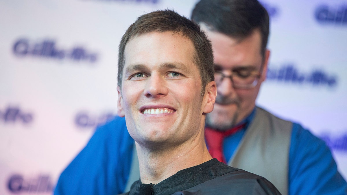 Super Bowl champion Tom Brady celebrates with a victory shave at Gillette World Shave headquarters on Thursday, Feb. 07, 2019 in Boston.