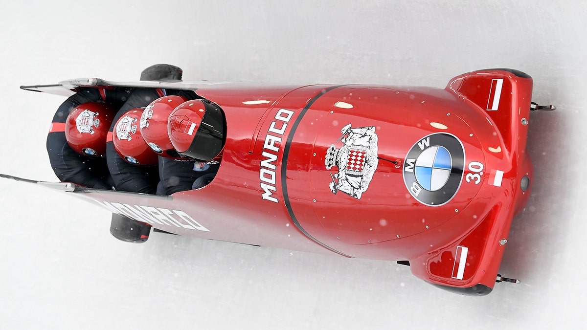 Driver Rudy Rinaldi, Boris Vain, Thibault Demarthon, and brakeman Mendonnaca Steven Borges of Monaco round a turn in the first run of the four-man Bobsled World Cup event, Saturday, Feb. 16, 2019, in Lake Placid, N.Y.