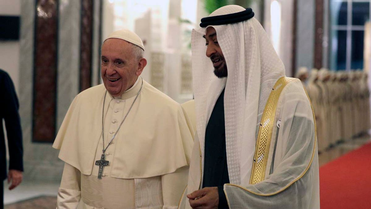 Pope Francis is welcomed by Abu Dhabi's Crown Prince Sheikh Mohammed bin Zayed Al Nahyan, upon his arrival at the Abu Dhabi airport, United Arab Emirates, Sunday, Feb. 3, 2019. Francis traveled to Abu Dhabi to participate in a conference on interreligious dialogue sponsored the Emirates-based Muslim Council of Elders, an initiative that seeks to counter religious fanaticism by promoting a moderate brand of Islam. (AP Photo/Andrew Medichini, Pool)