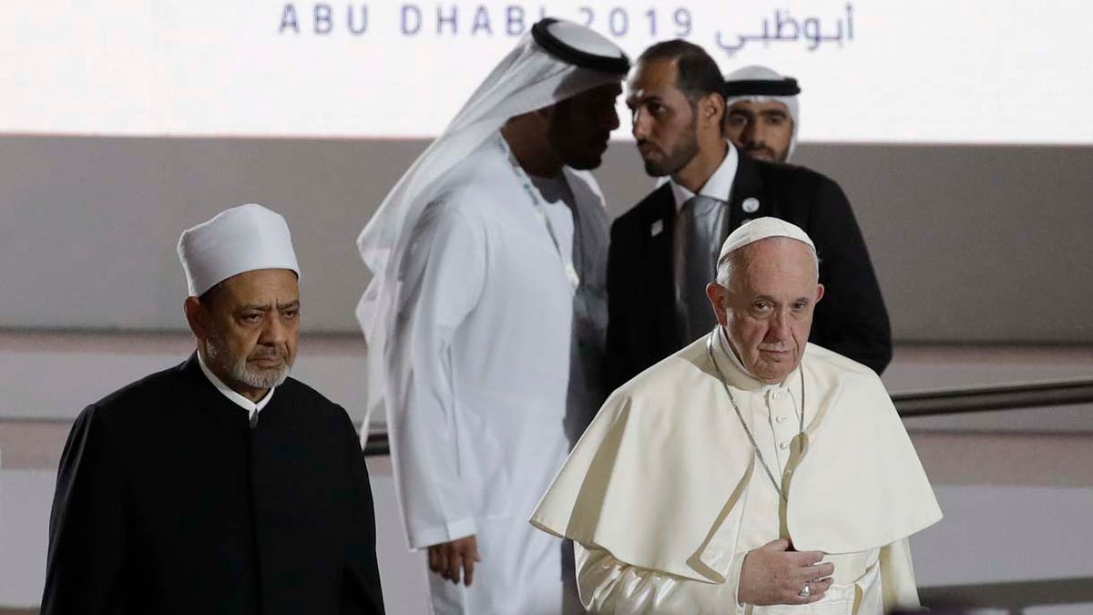Pope Francis is flanked by Sheikh Ahmed el-Tayeb, the grand imam of Egypt's Al-Azhar as they arrive for an Interreligious meeting at the Founder's Memorial in Abu Dhabi, United Arab Emirates, Monday, Feb. 4, 2019. (AP Photo/Andrew Medichini)
