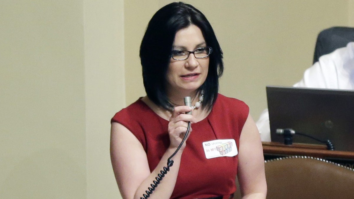 Rep. Mary Franson, R-Alexandria, voices her opposition to the bill to unionize day care providers during a debate as the Minnesota legislative session came to a close Monday, May 20, 2013, in St. Paul, Minn. (AP Photo/Jim Mone)