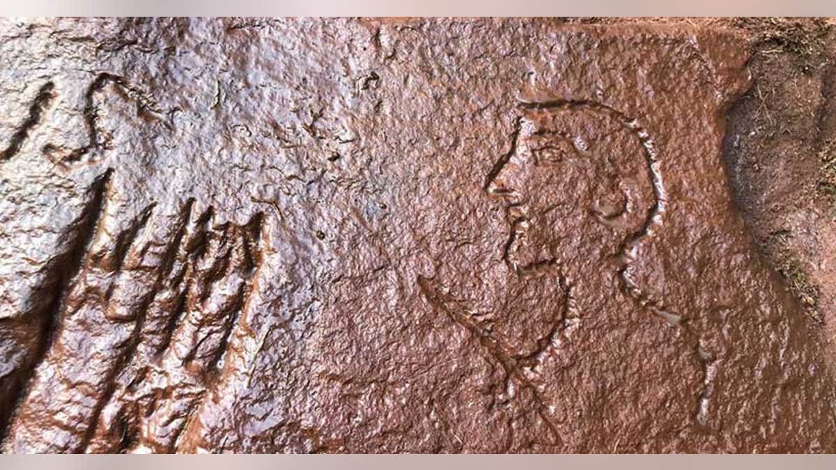 The caricature of a Roman officer cut into the ancient quarry near Hadrian's Wall.