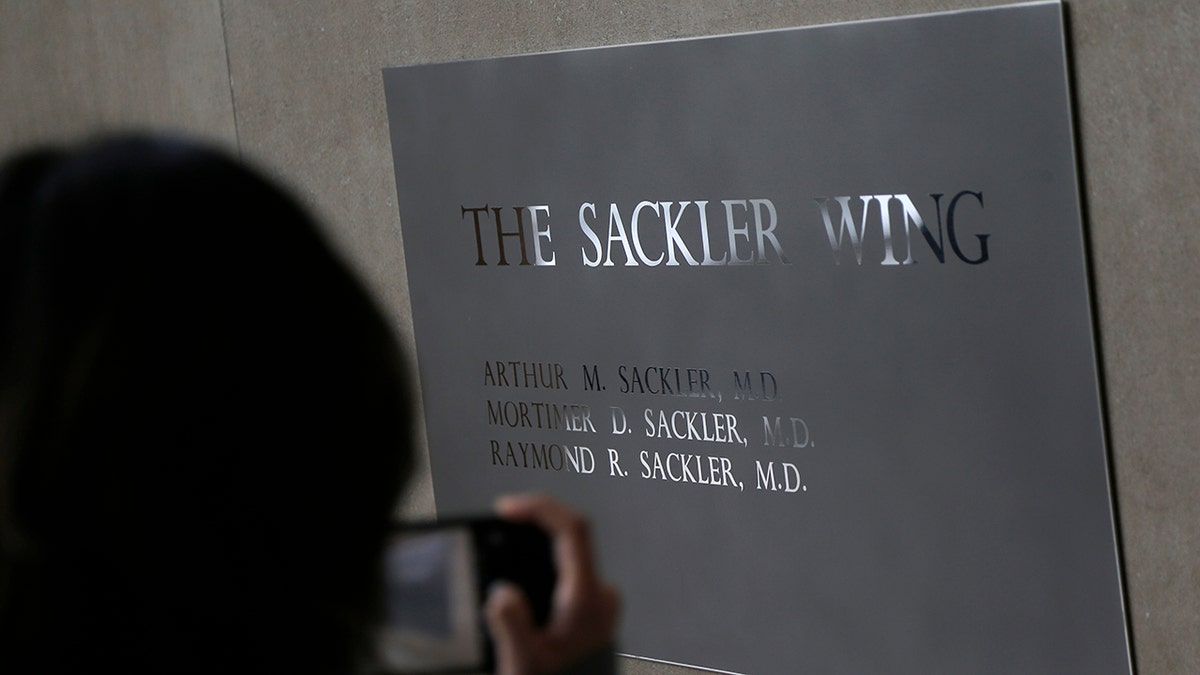 A sign with some names of the Sackler family is displayed at the Metropolitan Museum of Art in New York.