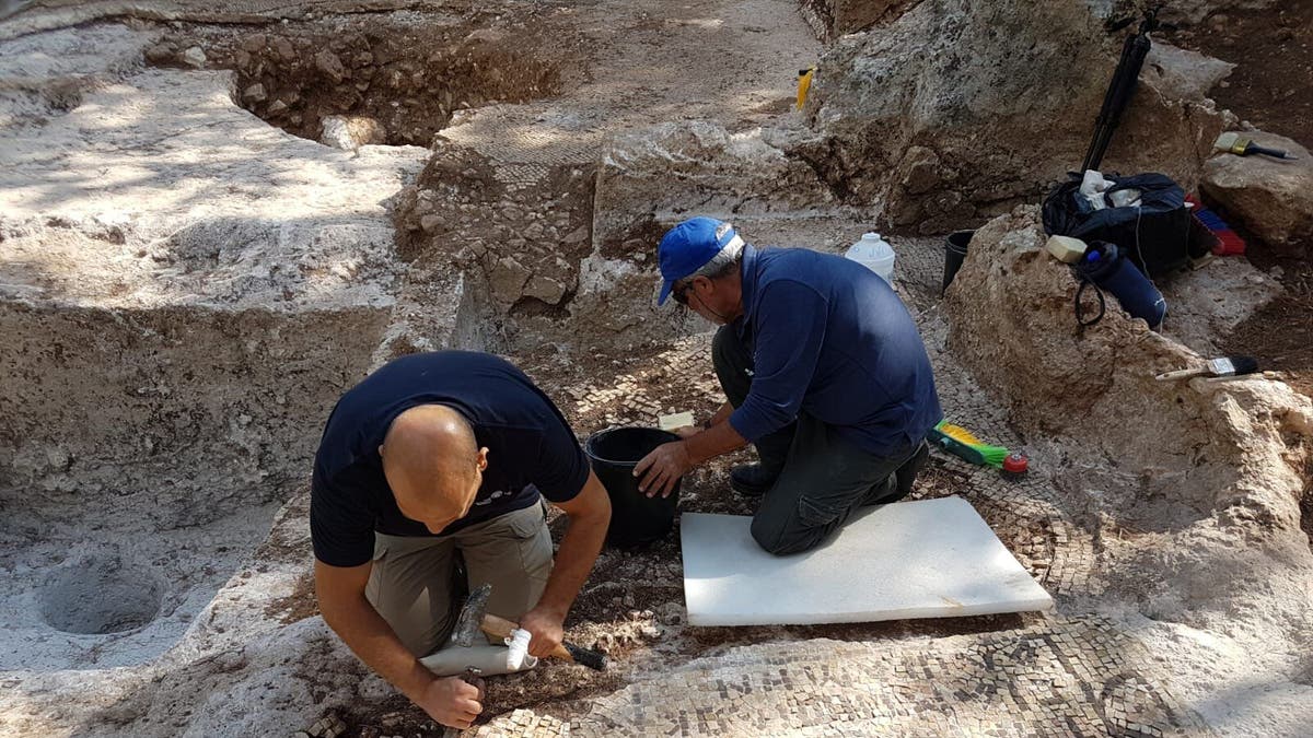 Archaeologists working on the ancient site.