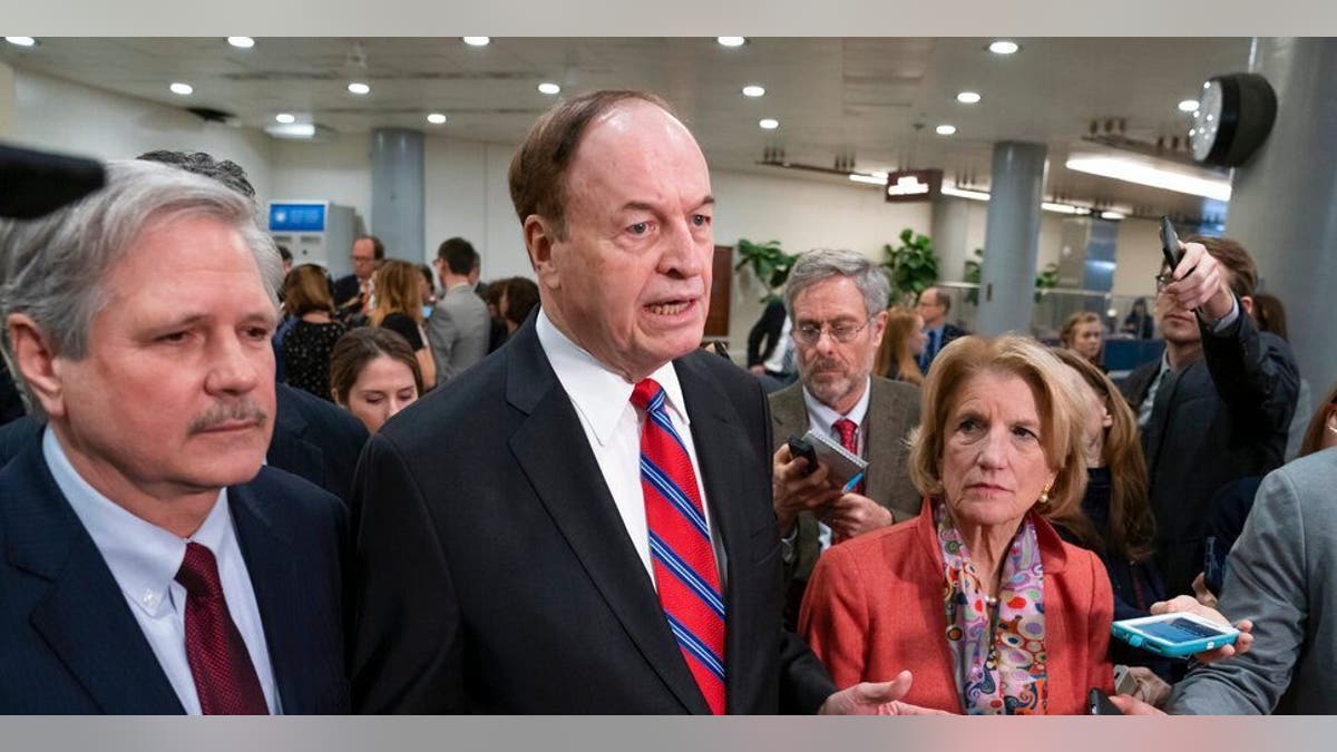 In this Feb. 6, 2019, photo, Sen. Richard Shelby, R-Ala., the top Republican on the bipartisan group bargainers working to craft a border security compromise in hope of avoiding another government shutdown, is joined by Sen. John Hoeven, R-N.D., left, and Sen. Shelley Moore Capito, R-W.Va., right, as they speak with reporters in Washington. (AP Photo/J. Scott Applewhite)<br>