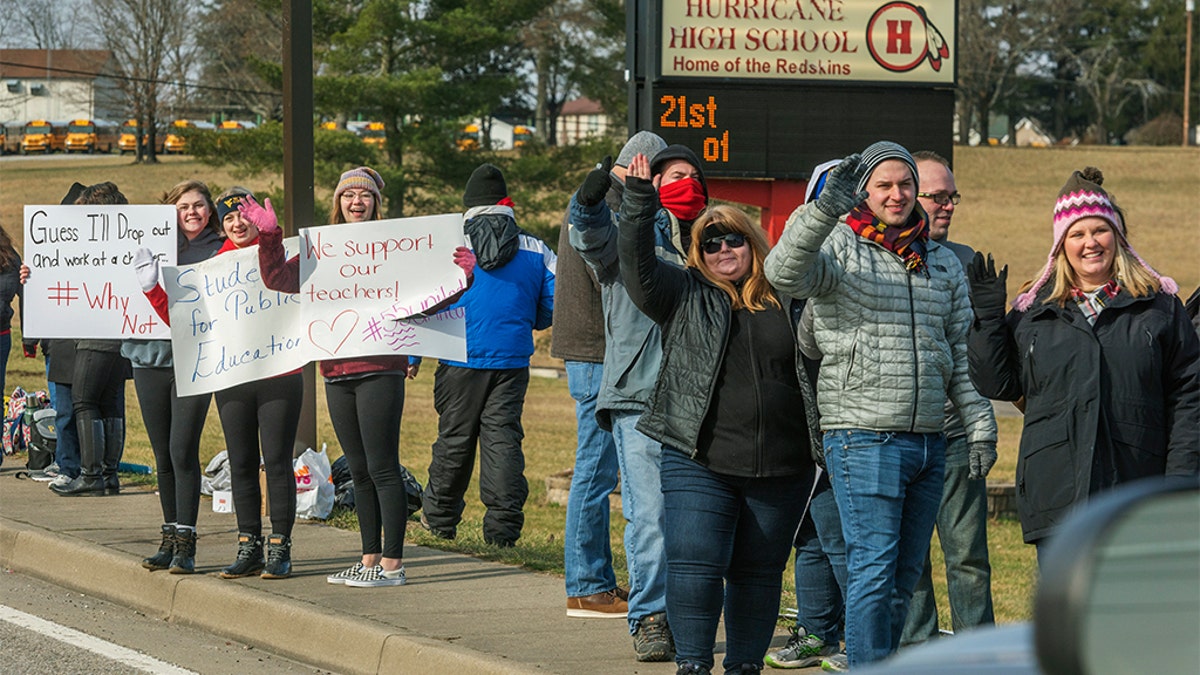 Teachers, students and supporters protested outside of Hurricane High School in Putnam County, West Virginia on Tuesday, Feb. 19, 2019.?