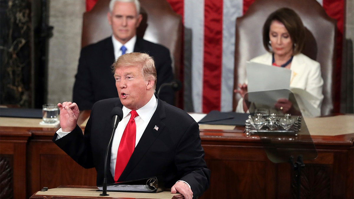 President Trump delivers his State of the Union address on Tuesday night, flanked by Vice President Mike Pence and House Speaker Nancy Pelosi. (AP Photo/Andrew Harnik)