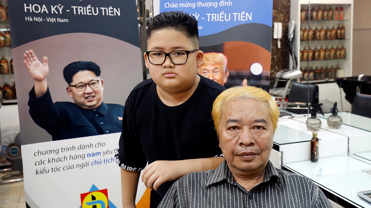 Short, back un sides: To Gia Huy, 9, and Le Phuc Hai, 66, pose after having their haircut in North Korean leader Kim Jong Un and U.S. President Donald Trump styles in a haircut salon in Hanoi, Vietnam February 19.