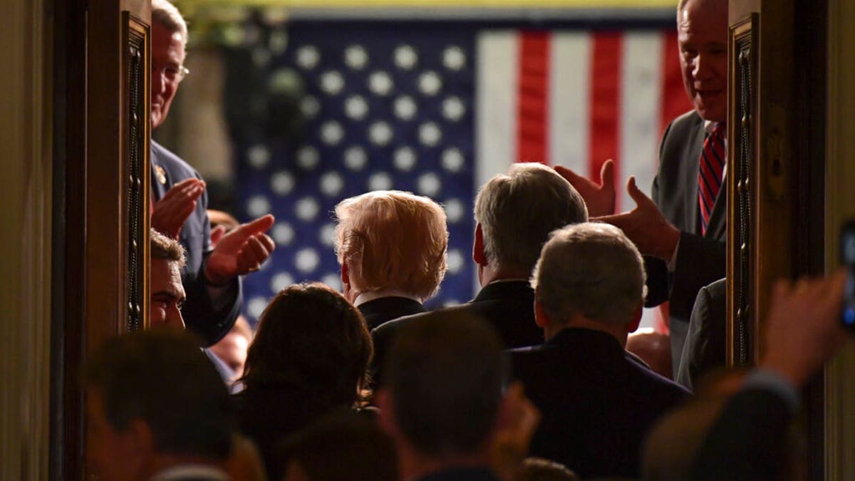 FILE- In this Jan. 30, 2018, file photo President Donald Trump walks into the House Chamber as he arrives for his State of the Union address to a joint session of Congress on Capitol Hill in Washington. The State of the Union address puts the president, his Cabinet, members of Congress, military leaders, top diplomats and Supreme Court justices all in the same place at the same time for all the world to see. Protecting everyone requires months of planning and coordination involving multiple law enforcement agencies, led by the U.S. Secret Service. (AP Photo/Susan Walsh, File)<br>
