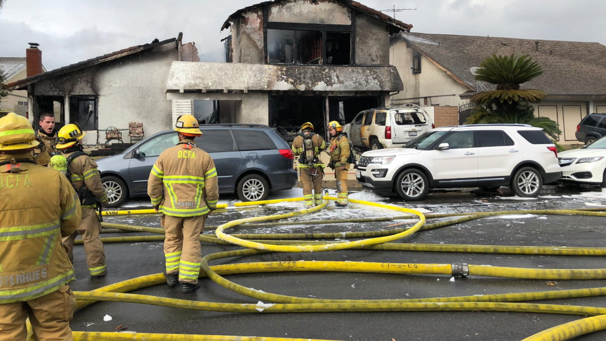 A small plane crashed in a residential California neighborhood on Sunday and set a single family home ablaze, officials said. 