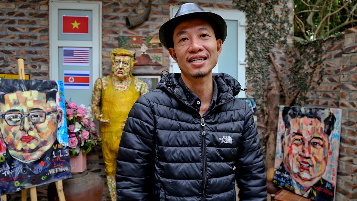 Artist Tran Lam Binh is seen with some of his creations in Hanoi, Vietnam, Feb. 25, 2019. (Associated Press)