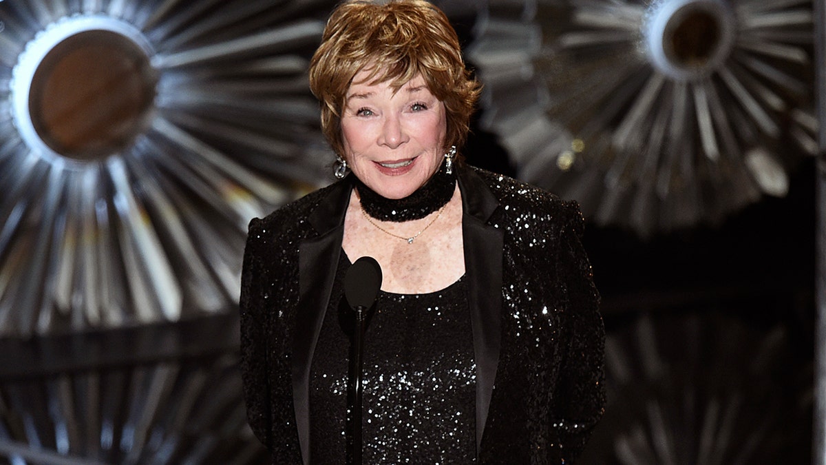 FILE - This Feb. 22, 2015, file photo shows Shirley MacLaine at the Oscars in Los Angeles. MacLaine was honored for career achievement by the AARP, the organization for retired persons and its AARP, The Magazine. The awards show will be broadcast Feb. 15, 2019, on PBS.  (Photo by John Shearer/Invision/AP, File)