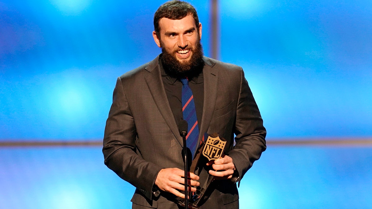 Andrew Luck of the Indianapolis Colts accepts the award for AP comeback player of the year. (Photo by Paul Abell/Invision for NFL/AP Images)