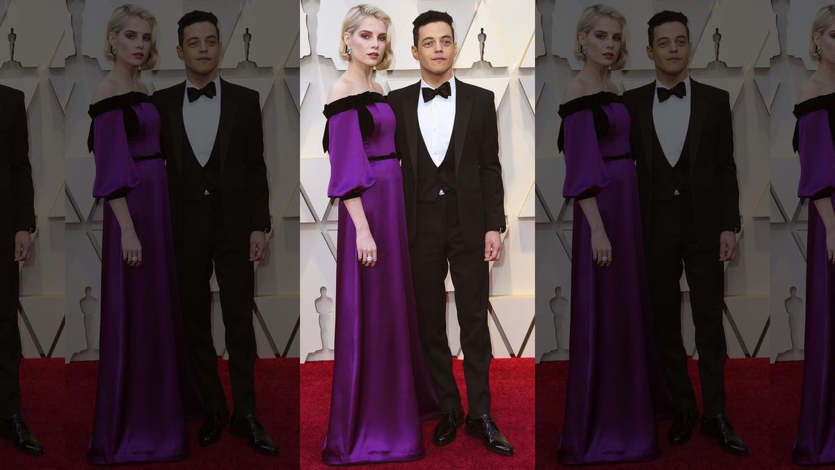 Lucy Boynton, left, and Rami Malek arrive at the Oscars on Sunday, Feb. 24, 2019, at the Dolby Theatre in Los Angeles.