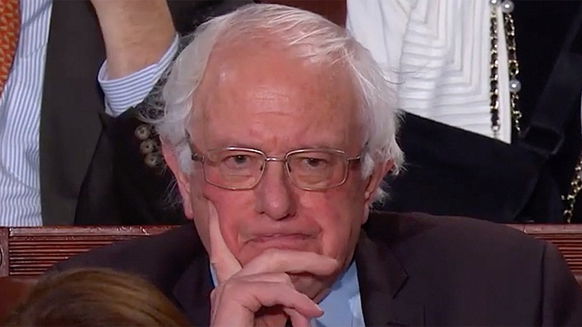 Sanders scowled as President Trump vowed that 'America will never be socialist.'