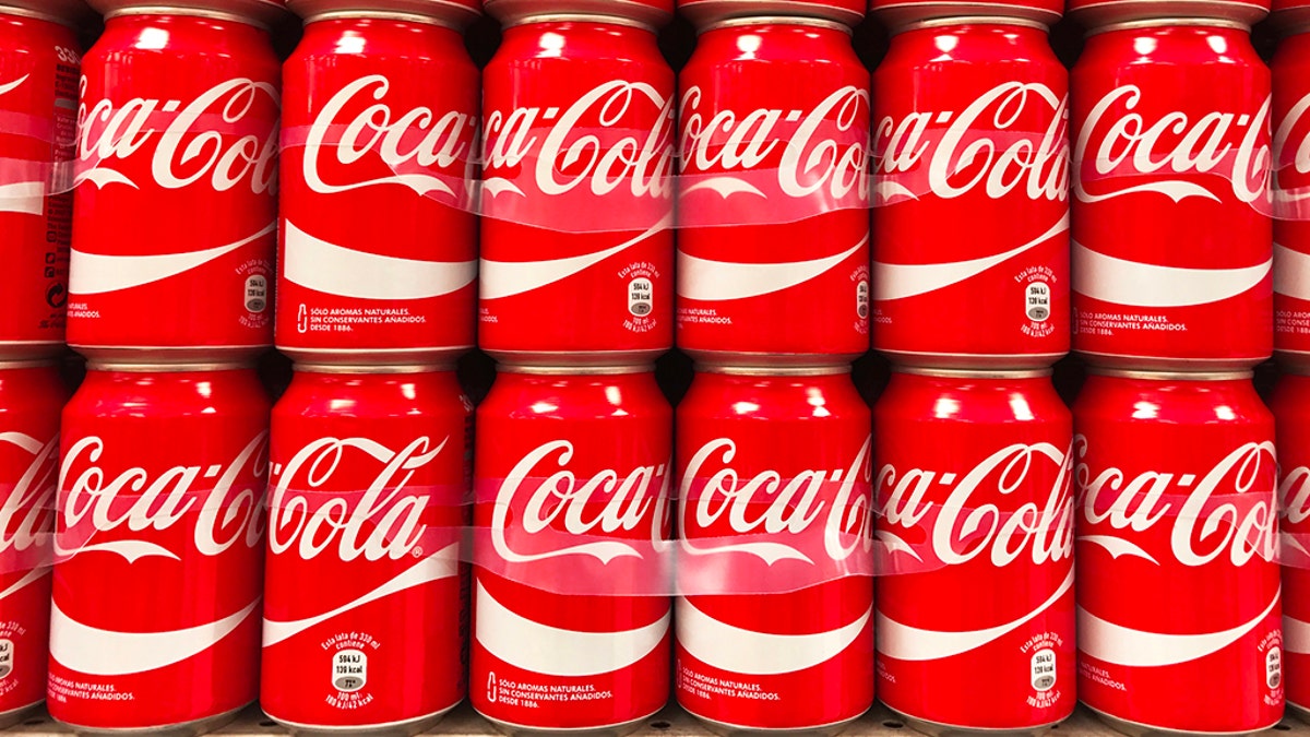 Coca-Cola cans in rows