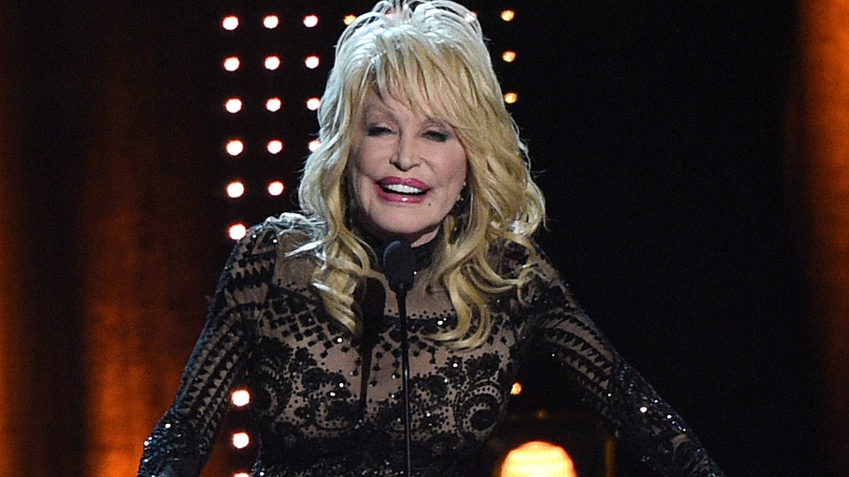Dolly Parton accepts her award at MusiCares Person of the Year on Friday, Feb. 8, 2018, at the Los Angeles Convention Center. (Photo by Chris Pizzello/Invision/AP)