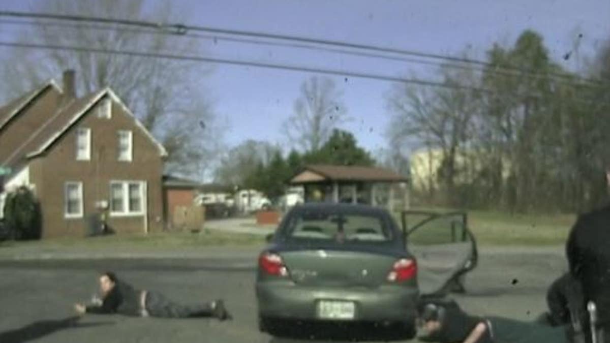 Julia Myers, 22, chugs a beer during her arrest on Monday, after leading officials in a high-speed chase, cops said.