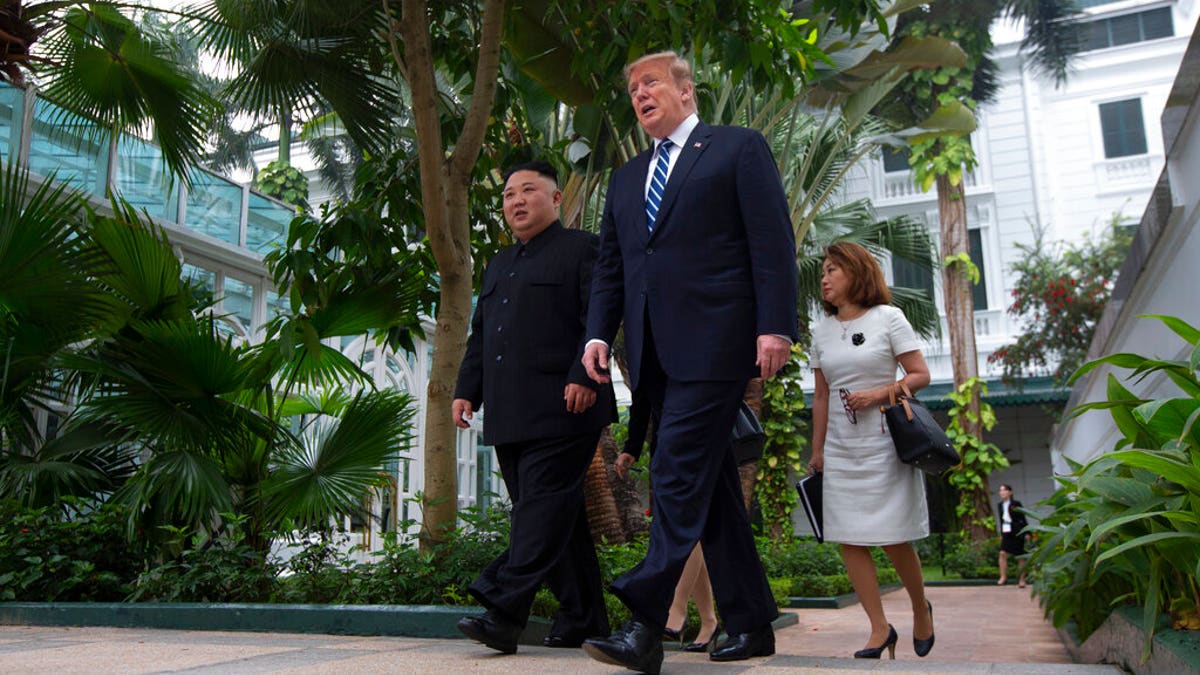 President Donald Trump and North Korean leader Kim Jong Un take a walk after their first meeting at the Sofitel Legend Metropole Hanoi hotel.