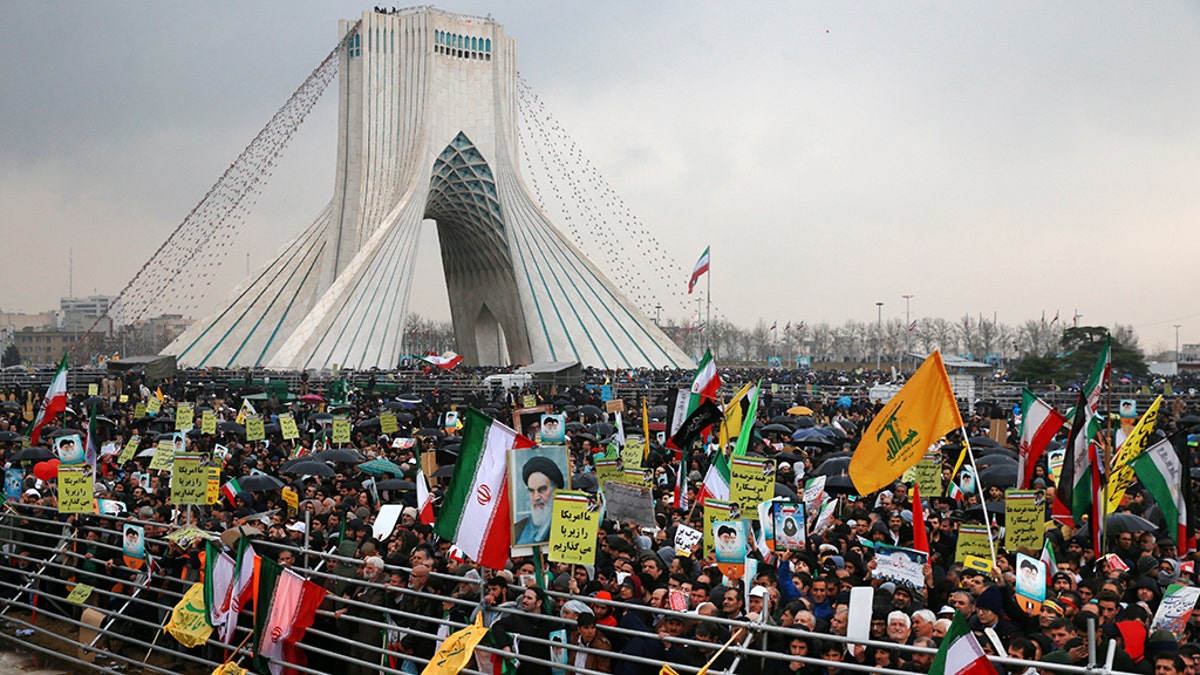 Iranians attend a ceremony celebrating the 40th anniversary of the Islamic Revolution, at the Azadi, or Freedom Tower, in Tehran, Iran, Monday, Feb. 11.