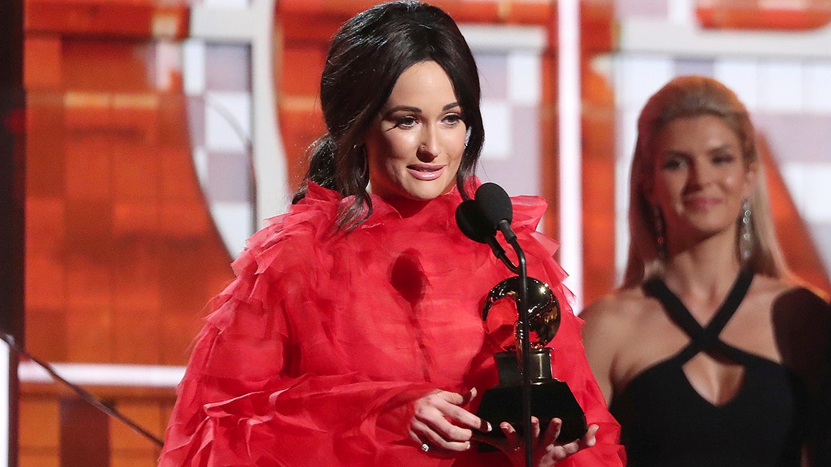 Kacey Musgraves accepts the award for best country album for 