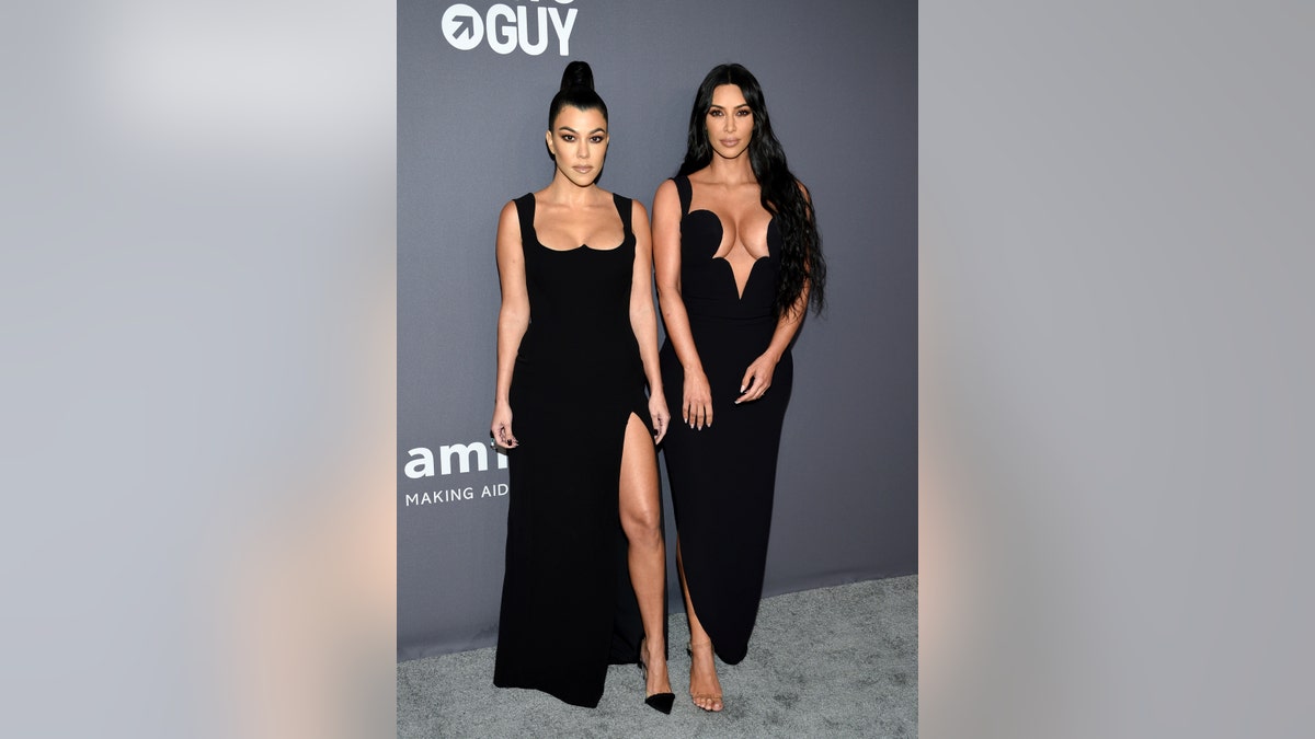 Television personalities Kourtney Kardashian, left, and Kim Kardashian West attend the amfAR Gala New York AIDS research benefit at Cipriani Wall Street on Wednesday, Feb. 6, 2019, in New York.