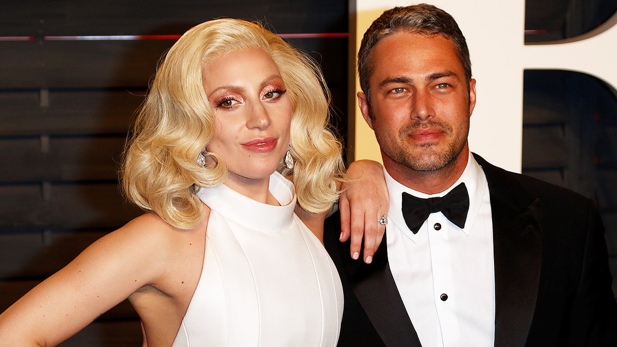Lady Gaga and Taylor Kinney attend the Vanity Fair Oscar Party at Wallis Annenberg Center for the Performing Arts in Beverly Hills, Los Angeles, USA, on 28 February 2016. Photo: Hubert Boesl - NO WIRE SERVICE - | usage worldwide (Photo by Hubert Boesl/picture alliance via Getty Images)