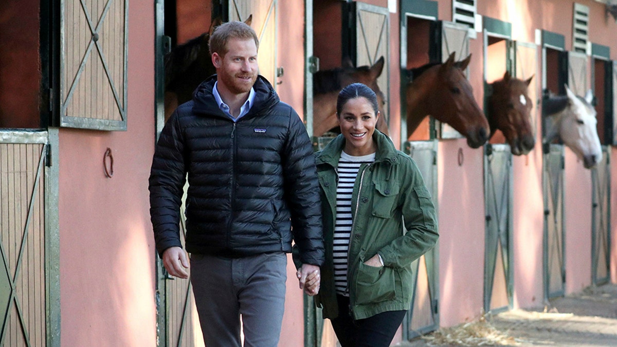 Britain's Prince Harry and Meghan, Duchess of Sussex, visit the Moroccan Royal Federation of Equitation Sports in Rabat, Morocco, Monday Feb. 25, 2019. The royal couple are expecting their first child in Spring 2019.