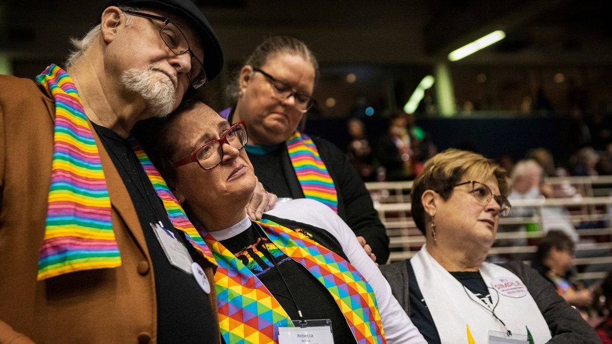 Ed Rowe, left, Rebecca Wilson, Robin Hager and Jill Zundel, react to the defeat of a proposal that would allow LGBT clergy and same-sex marriage within the United Methodist Church at the denomination's 2019 Special Session of the General Conference in St. Louis.