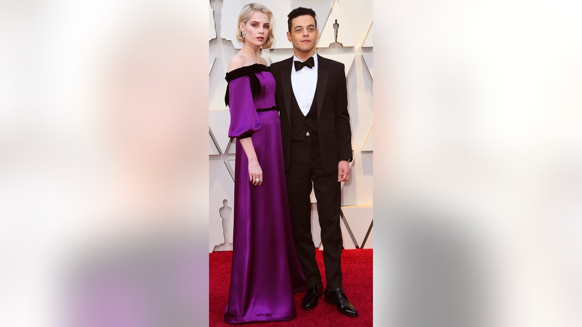 Lucy Boynton, left, and Rami Malek arrive at the Oscars on Sunday, Feb. 24, 2019, at the Dolby Theatre in Los Angeles. (Photo by Richard Shotwell/Invision/AP)
