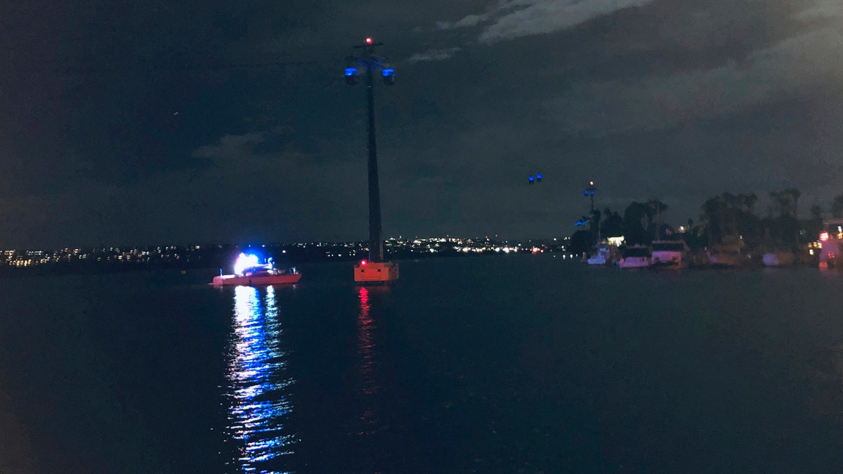 In this photo provided by Kasia Gregorczyk, more than a dozen people are trapped on a ride at SeaWorld Monday, Feb. 18, 2019, in San Diego.