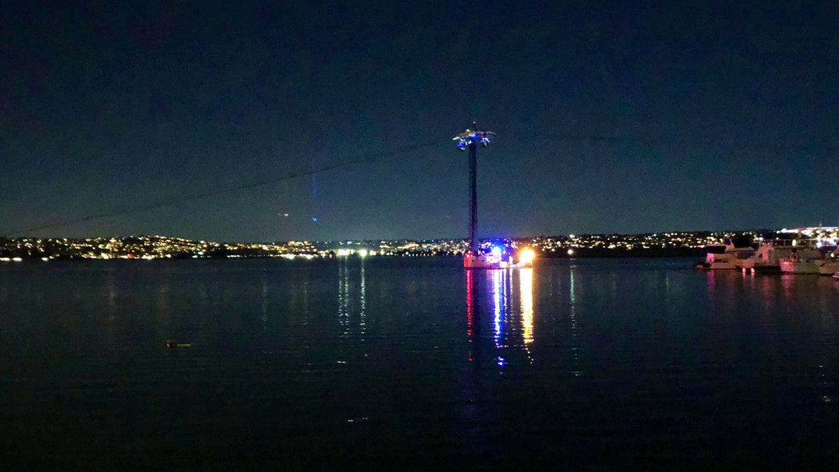 In this photo provided by Kasia Gregorczyk, more than a dozen people are trapped on a ride at SeaWorld Monday, Feb. 18, 2019, in San Diego.