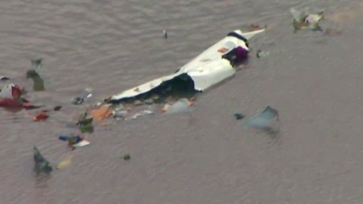This image taken from video provided by KRIV FOX 26 shows the scene of a cargo plane crash on Saturday, Feb. 23, 2019 in Trinity Bay, just north of Galveston Bay and the Gulf of Mexico in Texas.