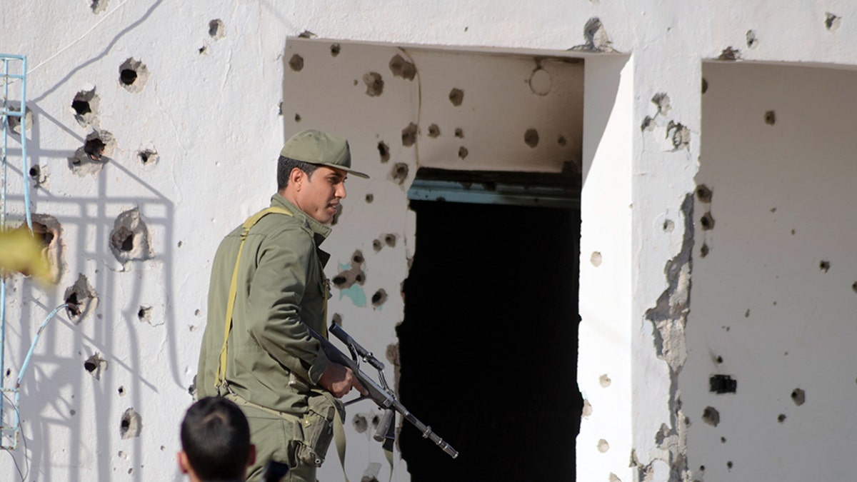 A member of the Tunisian special forces stands outside a bullet-riddled house in the southern town of Ben Guerdane, near the Libyan border, during clashes with jihadists in 2016.