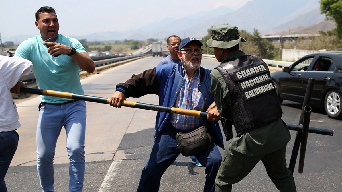 The clash came as Maduro announced Thursday plans to close the vast, jungle border with Brazil a day after he blocked air and sea travel between Venezuela and the nearby Dutch Caribbean island of Curacao, where the first cargo of relief supplies arrived earlier that day.