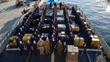 Nearly 35,000 pounds of cocaine was seized in international waters by the Coast Guard and off-loaded in Florida on Tuesday, officials said.
