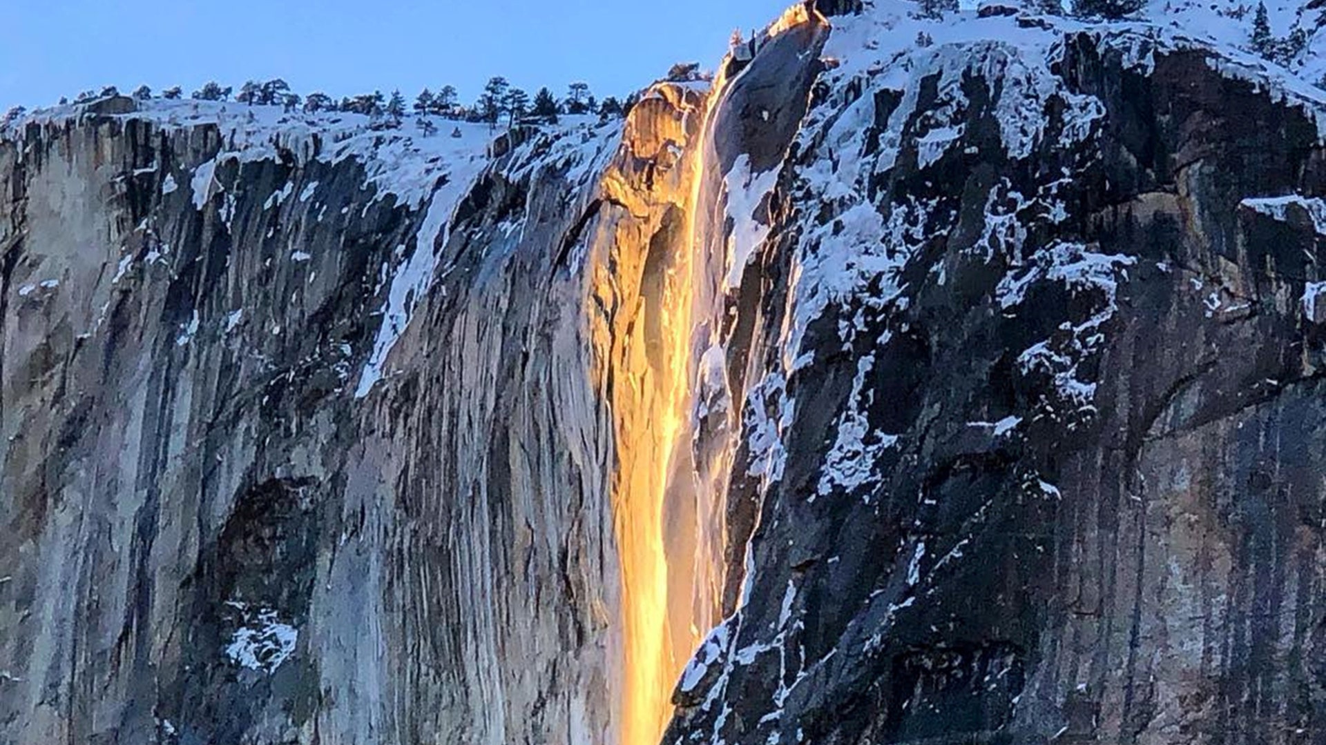 Sunlight hits the Horsetail Falls turning it into a "Firefall", at Yosemite National Park, Calif., Feb. 18, 2019.