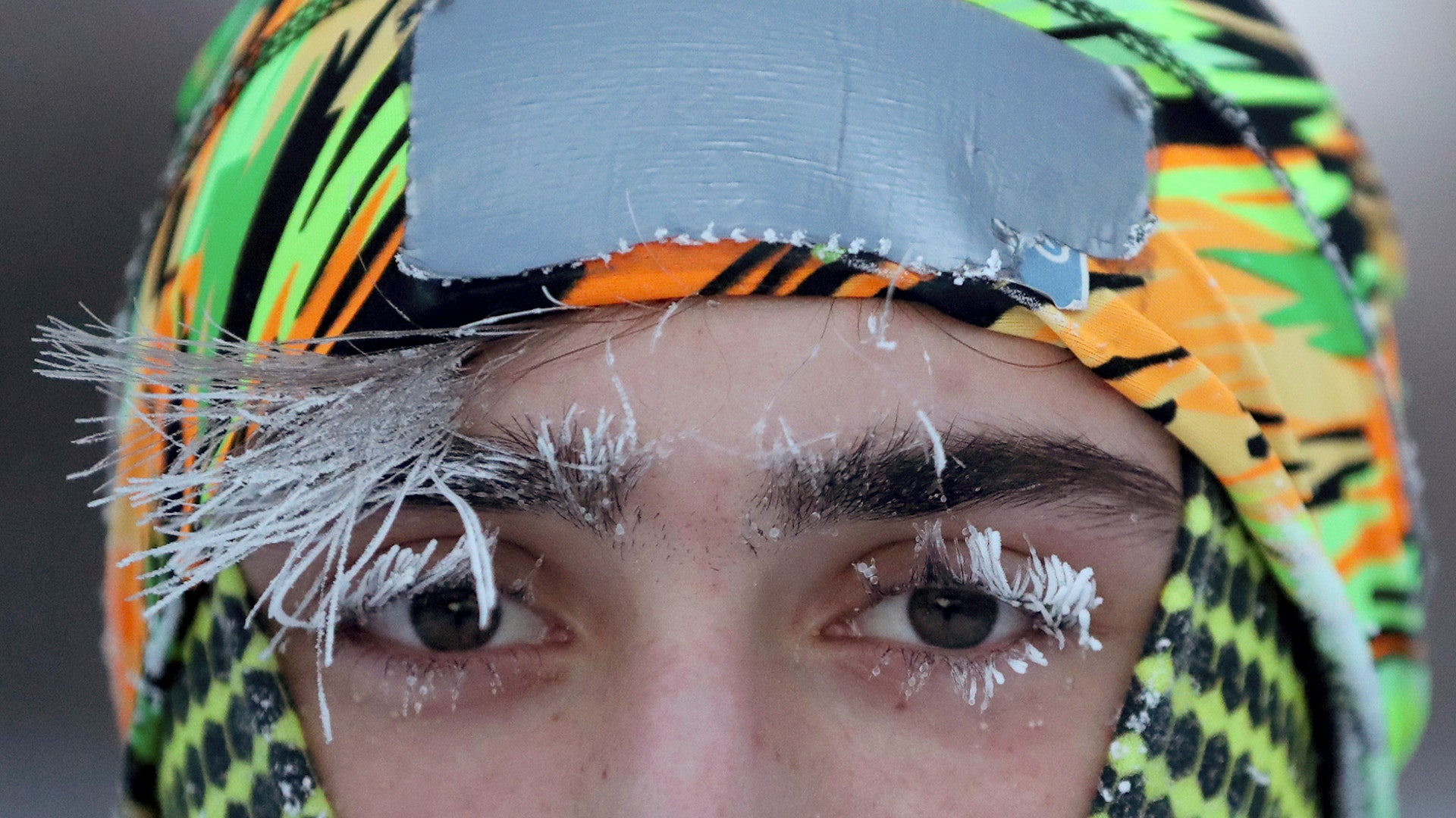 Frost covers part of the face of University of Minnesota student Daniel Dylla during a morning jog along the Mississippi River Parkway in Minneapolis, January 29, 2019. 