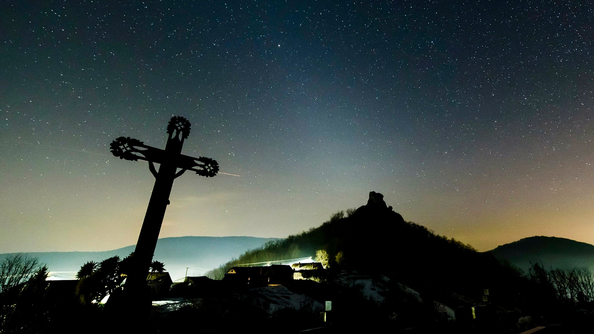 The white glow of zodiacal light is visible in the night sky as photographed near Hajnacka, southern Slovakia, Feb. 7, 2019. 
