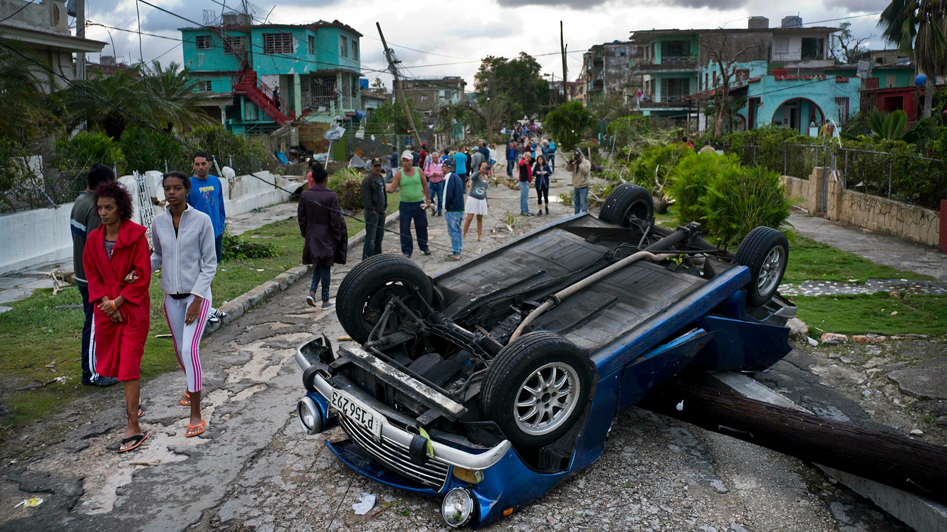 A car overturned by a tornado lays smashed on top of a street pole in Havana, Cuba, January 28, 2019.